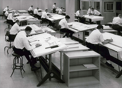 AEI workers at their drafting tables.